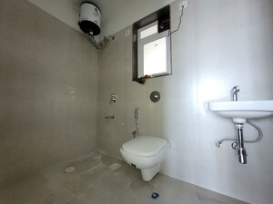 Bathroom in 1 BHK Apartment at Puranik City Reserva, Ghodbunder Road – for Rent