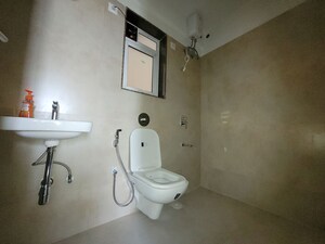 Bathroom in 2 BHK Apartment at Puranik City Reserva, Ghodbunder Road – for Rent
