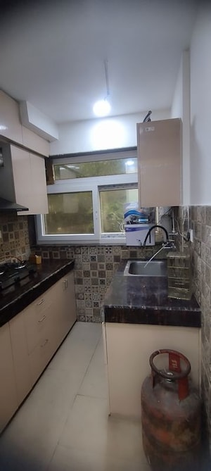 Kitchen in Studio Apartment at DLF Capital Greens Phase I And II, Moti Nagar – for Rent