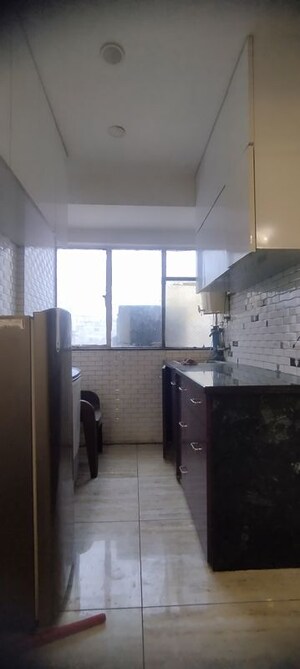 Kitchen in Studio Apartment at DLF Capital Greens Phase I And II, Moti Nagar – for Rent