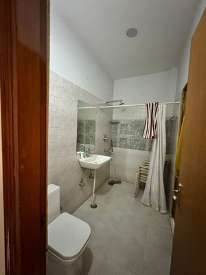 Bathroom in 3 BHK Apartment at Vasundhara Sector 4 – for Rent