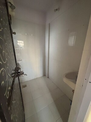 Bathroom in 1 BHK Apartment at Raunak Unnathi Greens, Kasarvadavali – for Rent