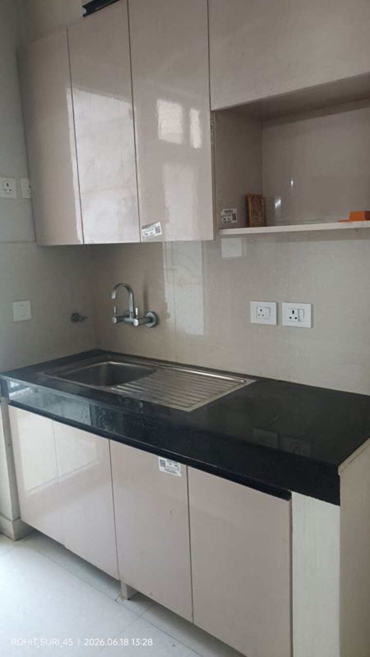 Kitchen, eldeco-live-by-the-greens 2 Bedroom 1100 Sq.Ft. Apartment In Sector 150 Noida 10580919