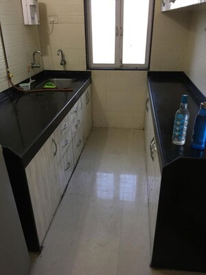 Kitchen in 1 BHK Apartment at Cosmos Jewels Ruby, Ghodbunder Road – for Rent
