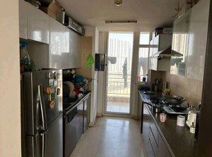 Kitchen in 3 BHK Apartment at Puri Diplomatic Greens Phase I, Sector 111 – for Sale