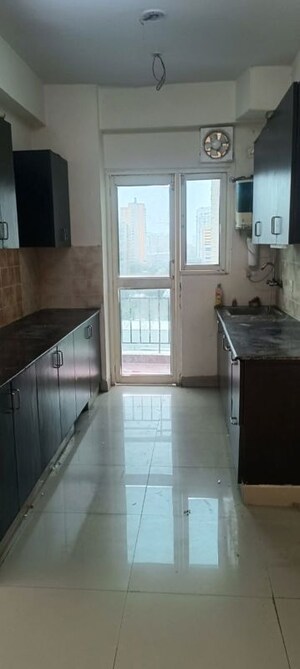 Kitchen in 2.5 BHK Apartment at Aims Golf City, Sector 75 – for Rent