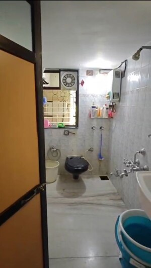 Bathroom in 2 BHK Apartment at Tirath Apartment, Vile Parle West – for Rent