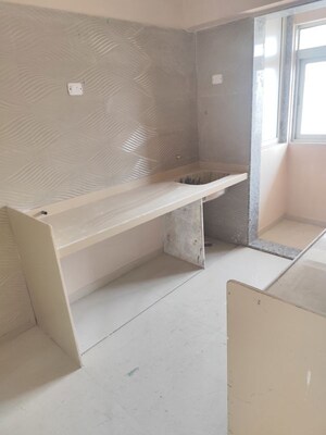 Kitchen in 2 BHK Apartment at Unnati Woods CHS, Kasarvadavali – for Sale