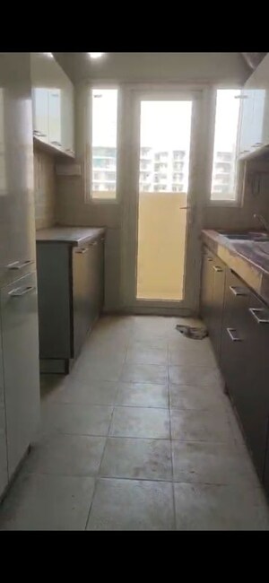 Kitchen in 3 BHK Apartment at Mahagun Moderne, Sector 78 – for Rent