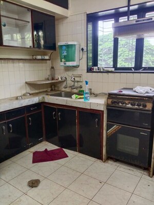 Kitchen in 2 BHK Apartment at Shri Senapati Bapat CHS, Senapati Bapat Road – for Rent