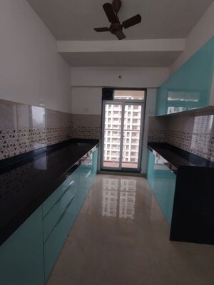 Kitchen in 2 BHK Apartment at Damji Shamji Mahavir Spring Tulip Phase 1, Pokhran Road No Two – for Sale