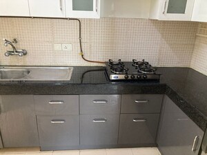 Kitchen in 3 BHK Apartment at Gaur Sportswood, Sector 79 – for Rent