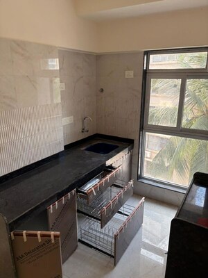 Kitchen in 1 RK Apartment at Romell Diva, Malad West – for Rent