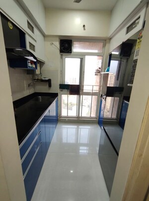 Kitchen in 1 BHK Apartment at Vijay Orovia, Ghodbunder Road – for Sale