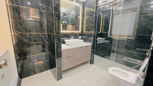 Bathroom in 4 BHK Apartment at Sarvapriya Vihar – for Rent