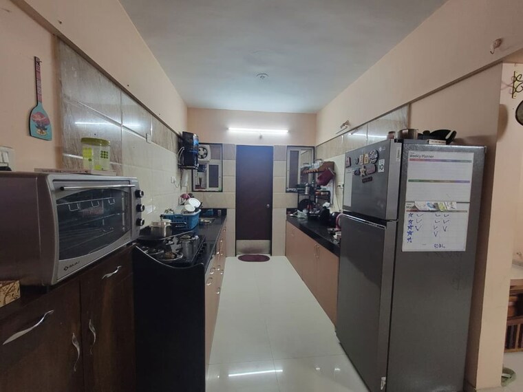 Kitchen, gk-royale-rahadki-greens-phase-2 3 Bedroom 1050 Sq.Ft. Apartment In Rahatani Pune 10583451