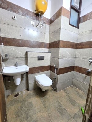Bathroom in 4 BHK Apartment at Dhakoli – for Sale