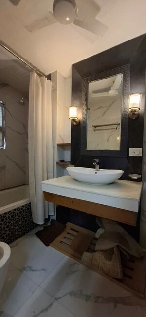 Bathroom in 4 BHK Builder Floor at Defence Colony – for Rent