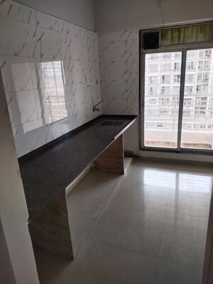 Kitchen in 2 BHK Apartment at Dosti Heritage, Karanjade – for Rent