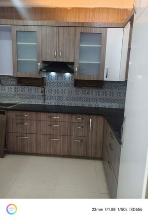 Kitchen in 2 BHK Apartment at Aims Golf City, Sector 75 – for Rent