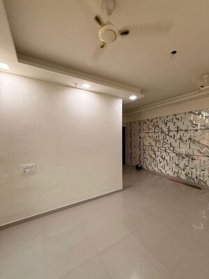 Living Room in 2 BHK Apartment at Tanvi Eminence, Mira Road – for Rent