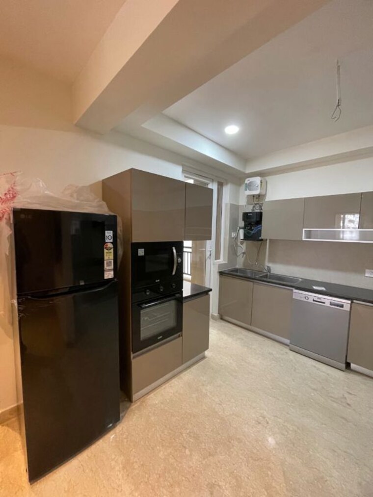 Kitchen, maya-green-lotus-utsav 3 Bedroom 1950 Sq.Ft. Apartment In International Airport Road Zirakpur 10584395