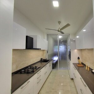 Kitchen in 3 BHK Apartment at Ruparel Ariana, Parel – for Sale