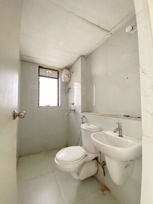 Bathroom in 1 BHK Apartment at Runwal Gardens, Dombivli East – for Rent