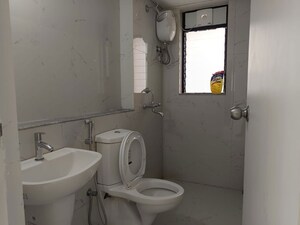 Bathroom in 1 BHK Apartment at Runwal Gardens, Dombivli East – for Rent