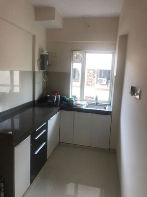 Kitchen in 1 BHK Apartment at Bombay Taximens CHS, Lbs Marg – for Rent