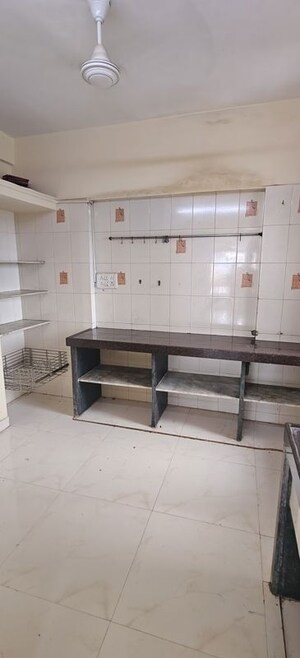 Kitchen in 2 BHK Apartment at Asmita Jyoti CHS, Malad West – for Rent