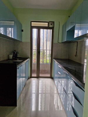 Kitchen in 2 BHK Apartment at Puranik Rumah Bali, Ghodbunder Road – for Sale