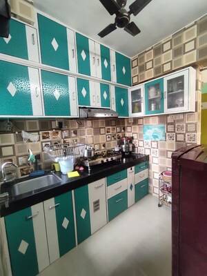Kitchen in 1 BHK Apartment at Kavya Hill View CHS, Anand Nagar – for Sale