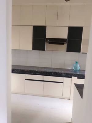 Kitchen in 3 BHK Apartment at Shri Radha Aqua Garden, Sector 16b Greater Noida – for Rent