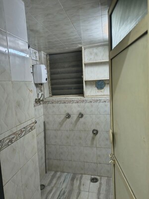 Bathroom in 2 BHK Apartment at Tilak Bhavana CHS, Tilak Nagar – for Rent