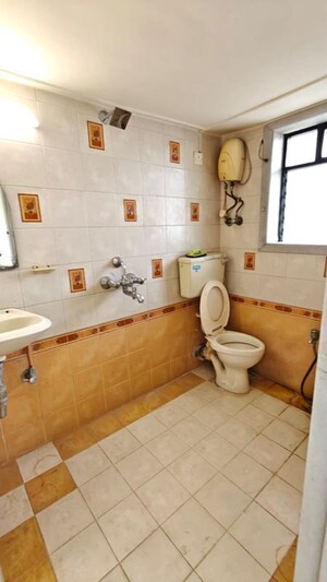 Bathroom in 3 BHK Apartment at Doordarshan CHS, Goregaon East – for Rent