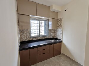 Kitchen in 1 BHK Apartment at Aanand Jai Bhavani CHS LTD SRA Project, Pokhran Road No Two – for Rent