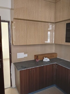 Kitchen in 2 BHK Apartment at Amrapali Hanging Gardens, Sector 107 – for Rent