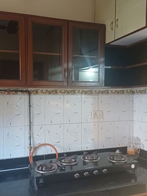 Kitchen in 2 BHK Apartment at Eden Woods complex, Manpada – for Rent