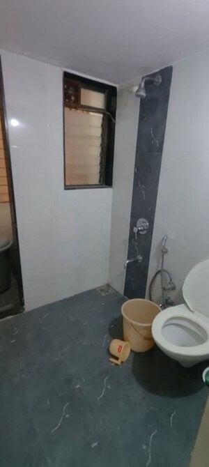 Bathroom in 2 BHK Apartment at Cosmos Lounge, Manpada – for Rent