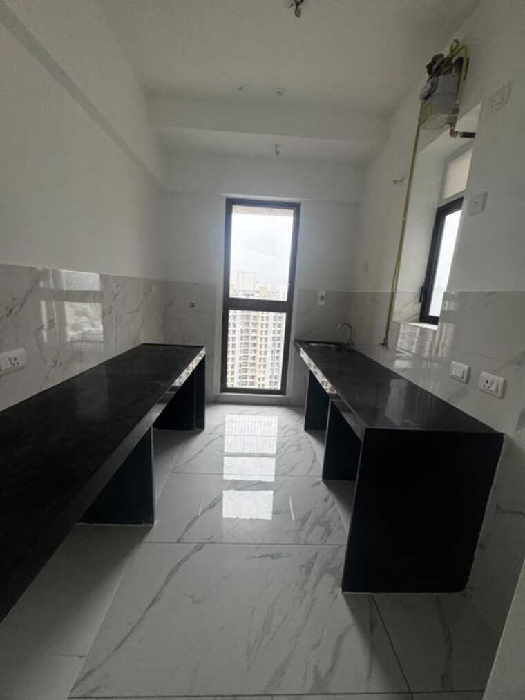 Kitchen, raymond-ten-x-habitat 2 Bedroom 595 Sq.Ft. Apartment In Pokhran Road No Two Thane 10589206