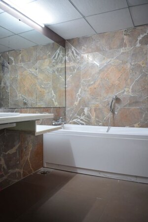 Bathroom in 4 BHK Apartment at Kolte Patil 24K Glitterati, Pimple Nilakh – for Rent