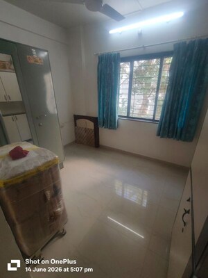 Living Room in 2 BHK Apartment at Woodland Avenue, Kothrud – for Rent