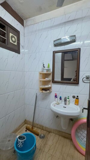 Bathroom in 2 BHK Builder Floor at Kalkaji – for Rent