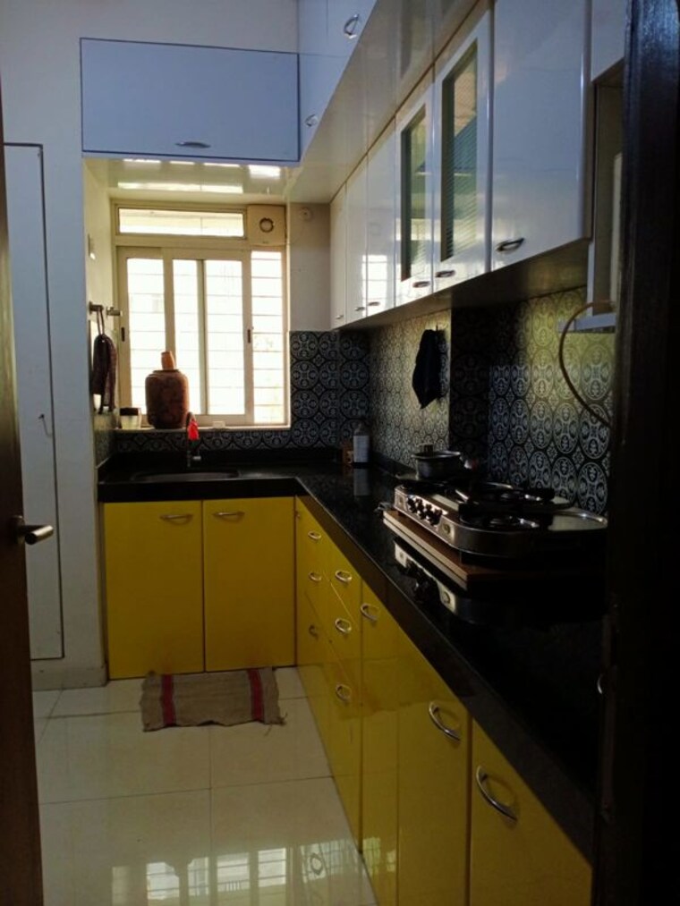 Kitchen, lodha-amara 1.5 Bedroom 750 Sq.Ft. Apartment In Kolshet Road Thane 10591308