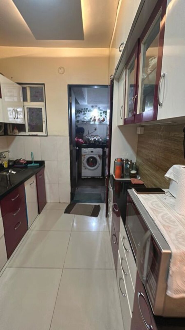Kitchen, karan-sara 2 Bedroom 1000 Sq.Ft. Apartment In Baner Pune 10591474