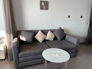 Living Room in 1 BHK Apartment at Supertech Supernova Nova Residences, Sector 94 – for Sale