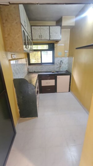 Kitchen in 1 BHK Apartment at Eden Woods complex, Manpada – for Rent