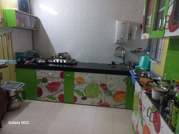 Kitchen, raviraj-tushar-garden 2 Bedroom 750 Sq.Ft. Apartment In Pimple Saudagar Pune 10591625