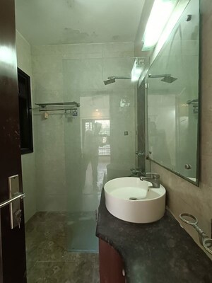 Bathroom in 3 BHK Builder Floor at Pamposh Enclave – for Sale